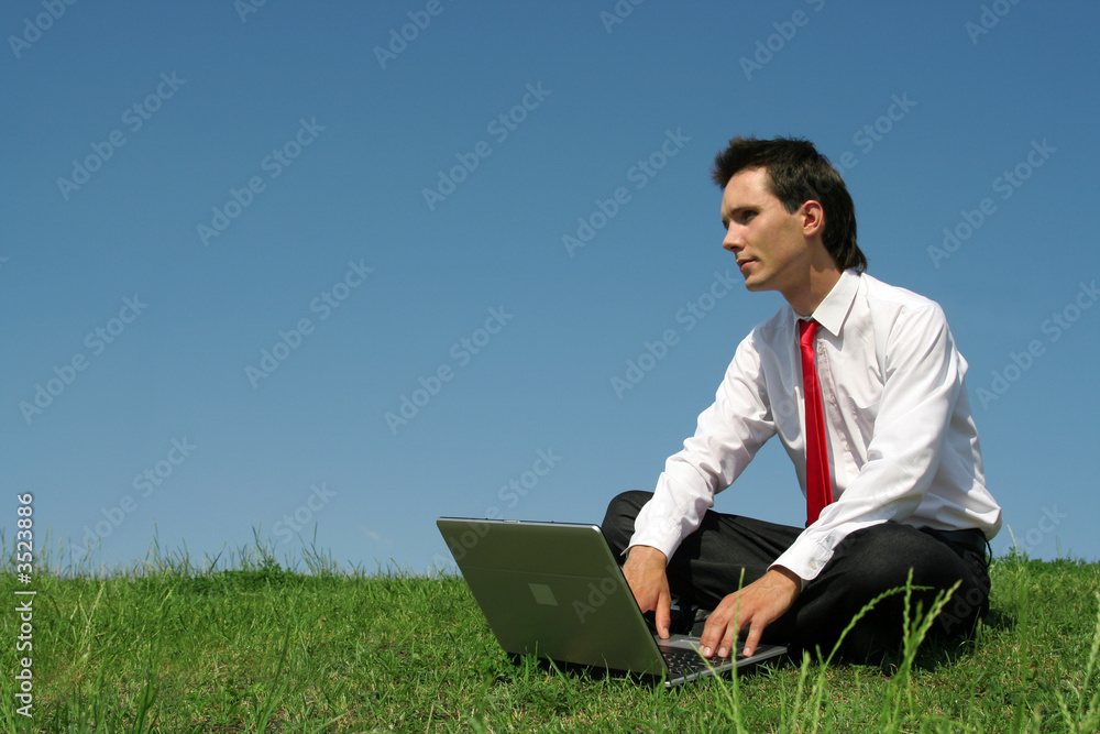 man sitting outdoors using laptop man sitting outdoors using laptop