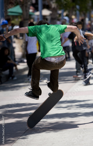 Vertical image of a skateboarder jumping / doing a trick