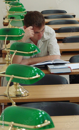 Student reading book in public library 1