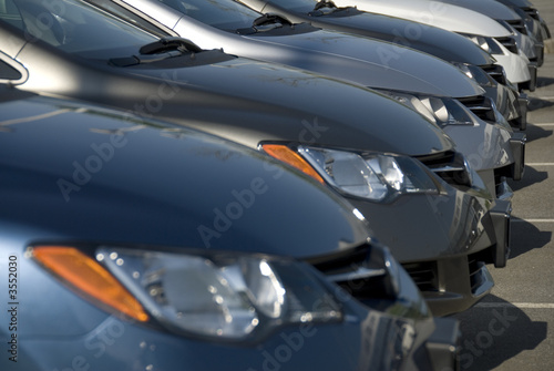A lineup of new cars at a dealership. © Gary Blakeley