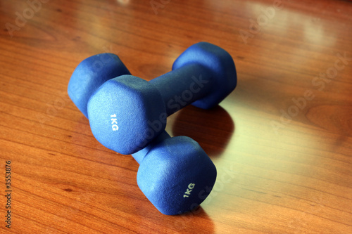 two dumbbells on the floor