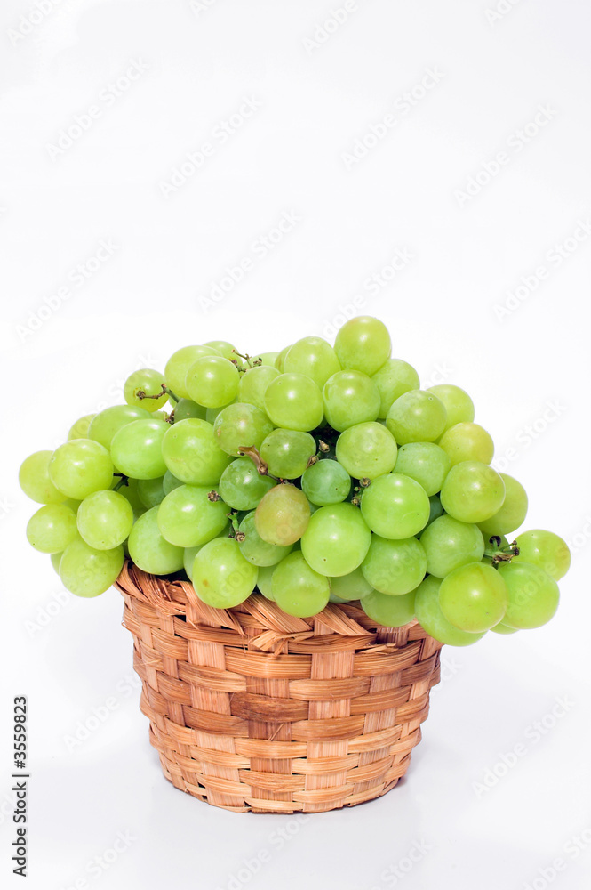 A basket full of fresh grapes. A basket full of fresh grapes.
