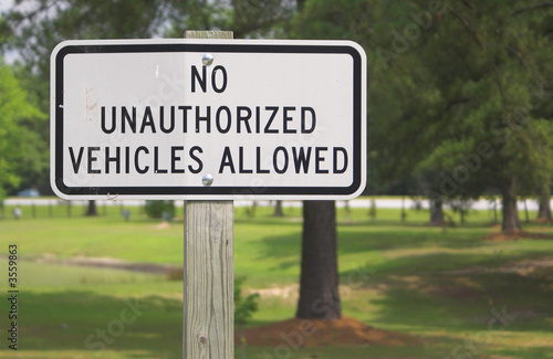A sign stating No Unauthorized Vehicles Allowed.