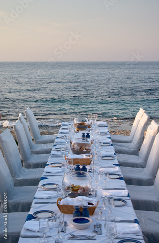 served table on the sea shore in resort
