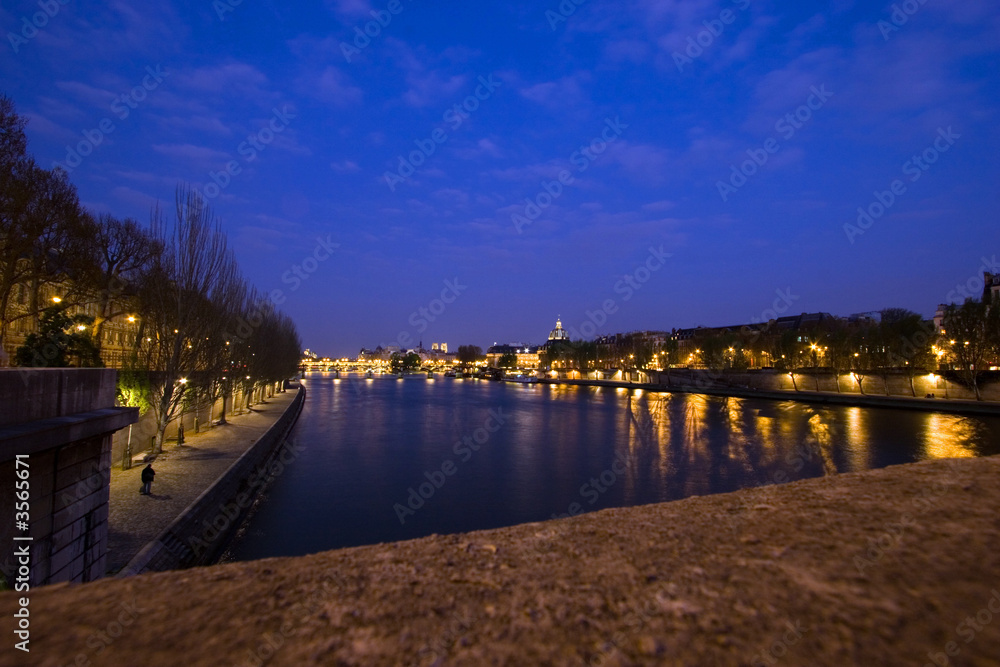 View up the Seine River at night, Paris, France