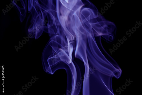 Purple Smoke abstract on black background .