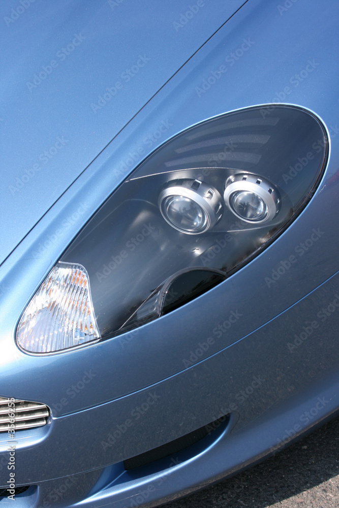 Headlamp on blue car