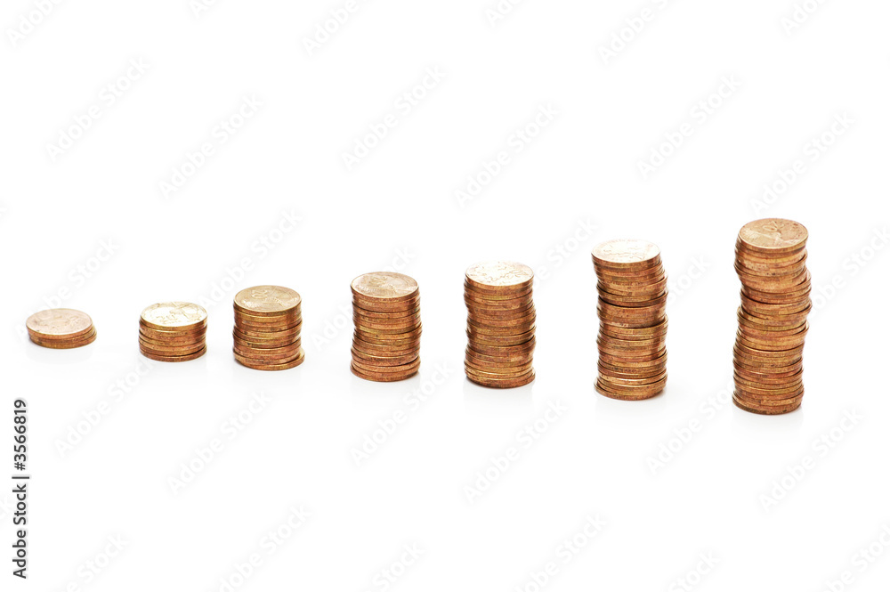 Stacks of coins isolated on the white background Stacks of coins isolated on the white background