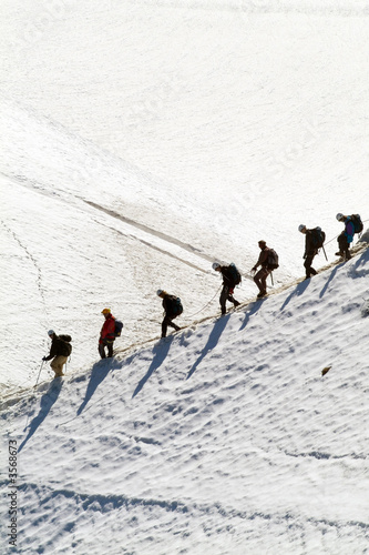 people walking by one glacier