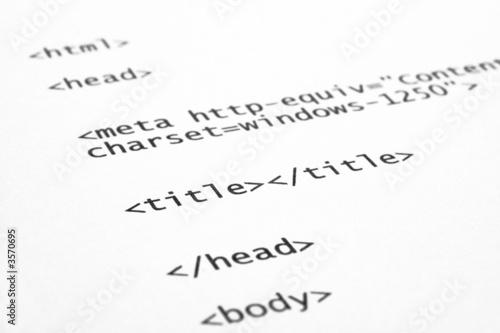 closeup of html code on white paper background
