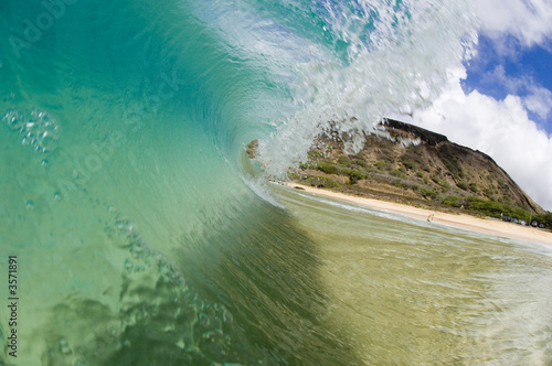 giant breaking wave in clear hawaii waters