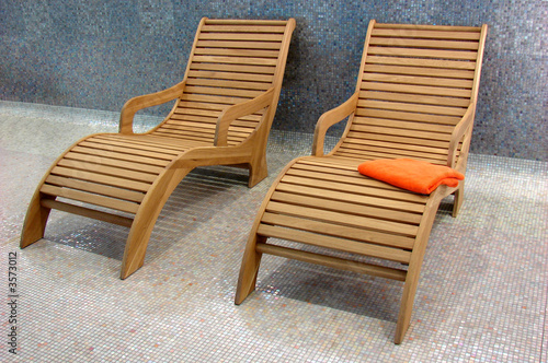 two Sunbeds in the fitness with one orange towel