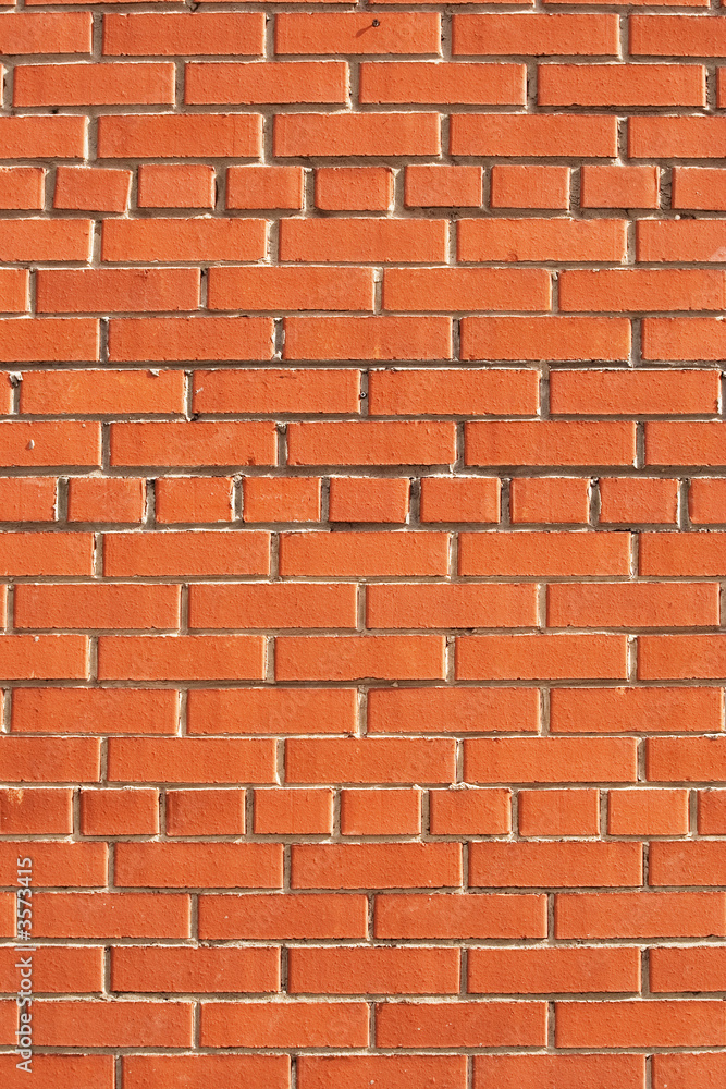 Simple brick wall laid with a red brick. Simple brick wall laid with a red brick.