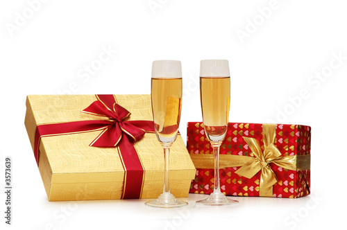 Giftboxes and champagne isolated on the  white