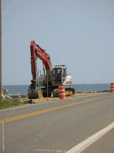 red excavator - coastal bulkhead at point lookout, maryland usa2 photo