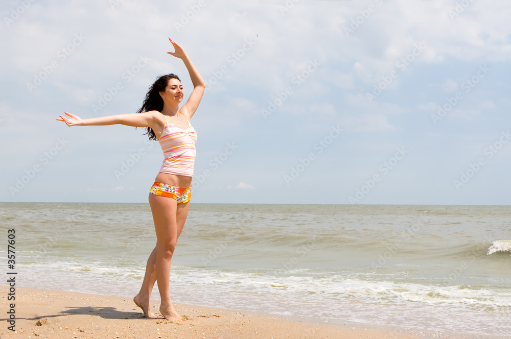 happy young woman dance on the beach happy young woman dance on the beach