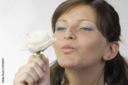 nice and young woman with roses in her hands