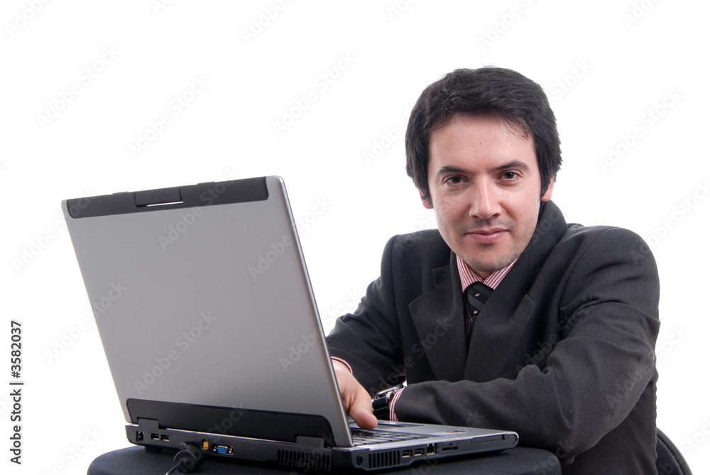 Handsome young business man working with laptop Handsome young business man working with laptop