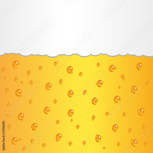 Glass of beer with bubbles and foam