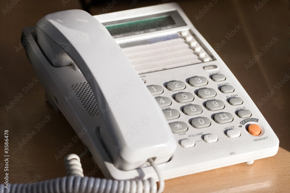 Modern table telephone. Closeup view. Modern table telephone. Closeup view.
