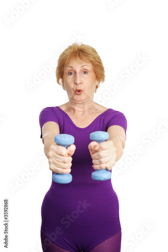 old woman working out with freeweights