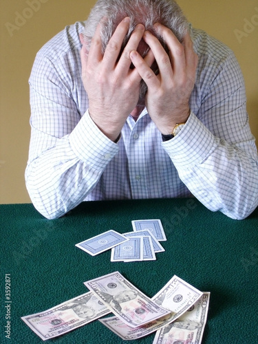 Card Player with Head Held in Hands
