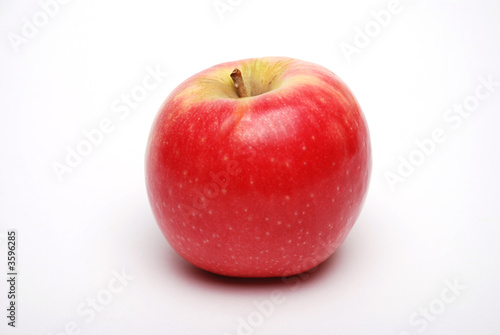Rosy red apple on white background