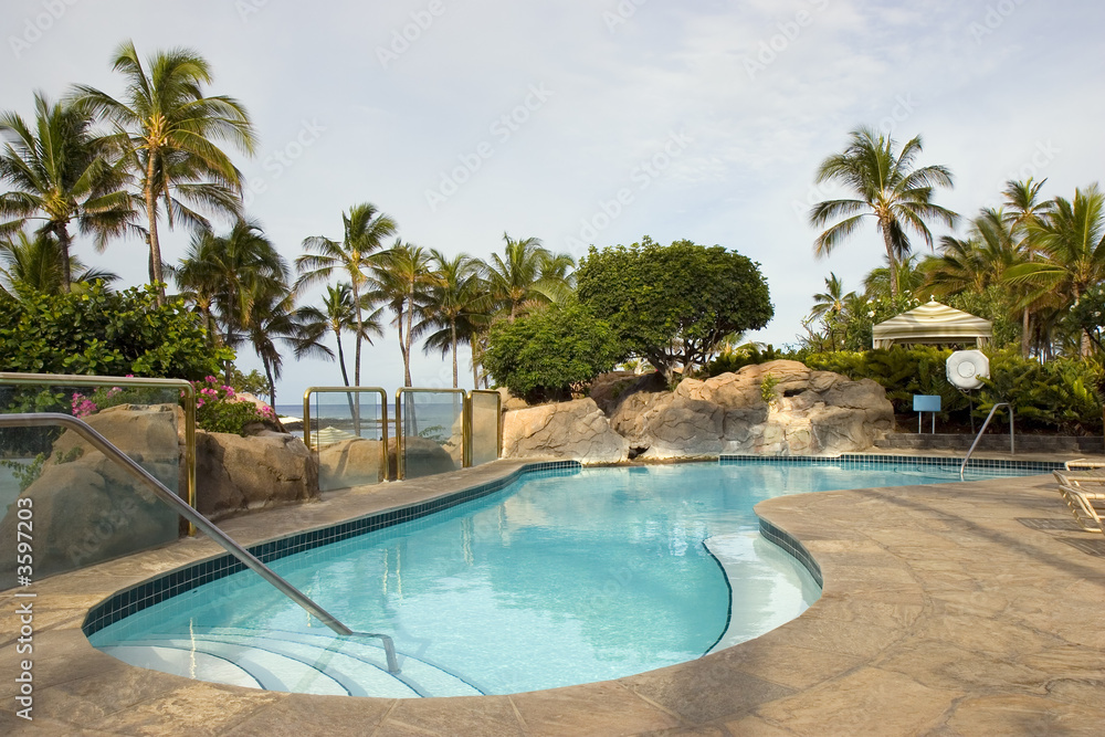 Tropical Resort Swimming Pool next to Ocean Beach