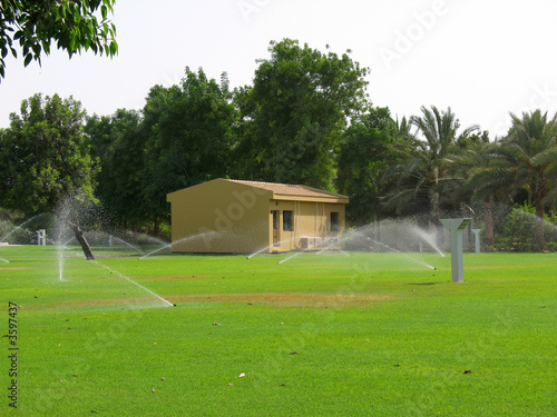 watering the park lawn
