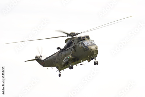 Fototapeta Naklejka Na Ścianę i Meble -  A Royal Air Force Sea King military Helicopter against a white background.