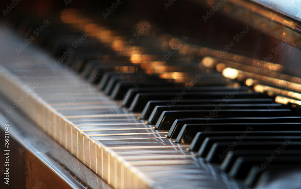 Naklejka premium a piano with the open black-and-white keyboard