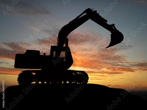 Heavy excavator over orange background photo
