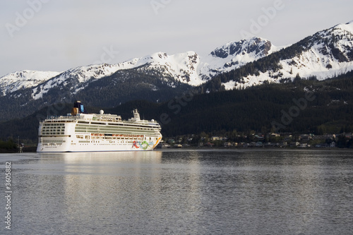 Cruise ship docked in Skagway Alaska with mountains