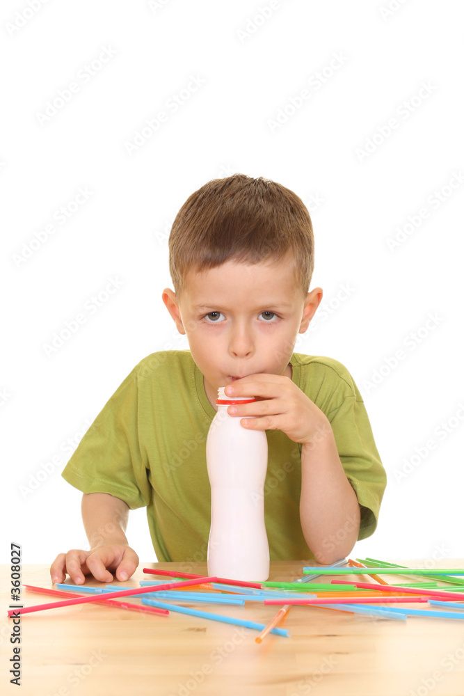five years old boy drinking milk isolated on white five years old boy drinking milk isolated on white