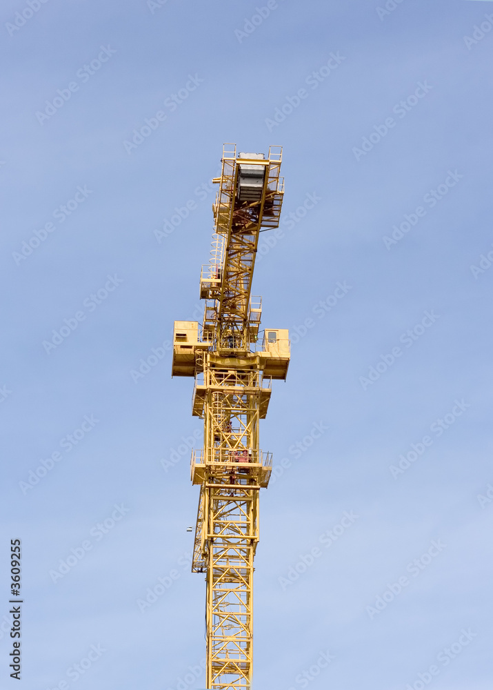 heavy isolated construction crane against a clear blue sky heavy isolated construction crane against a clear blue sky