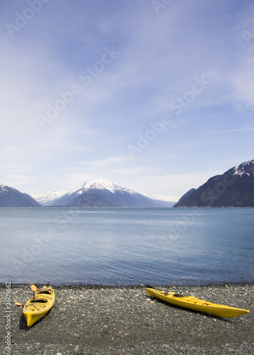 Snow capped mountains and kayaks near Haines Alaska
