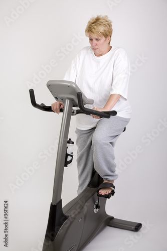puzzled look on woman's face on excercise bike