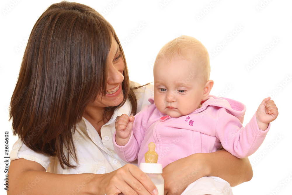 mother and 8 months baby girl with bottle of milk mother and 8 months baby girl with bottle of milk