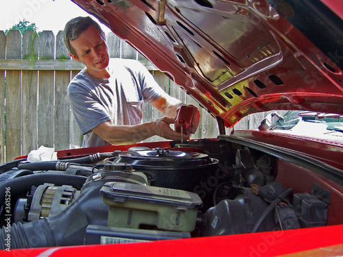 man working on car