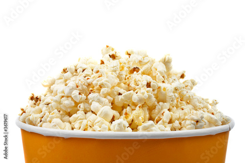Detail of popcorn in a bucket over a white background