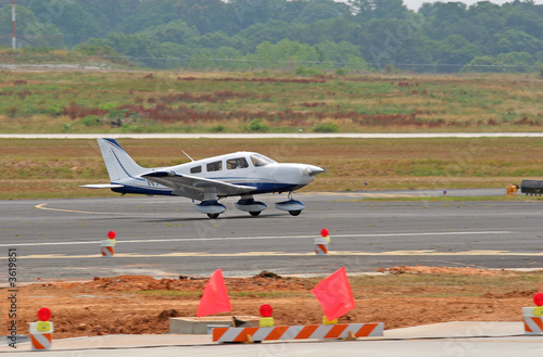 Blue and White Plane Landing