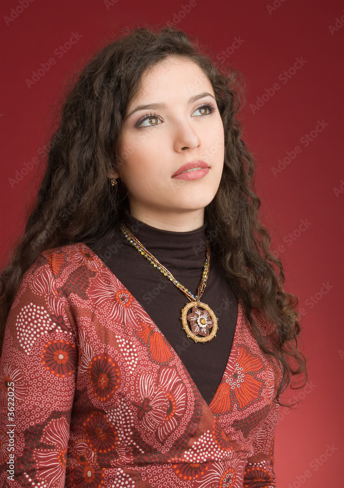 Woman in dress portrait isolated on red background Woman in dress portrait isolated on red background