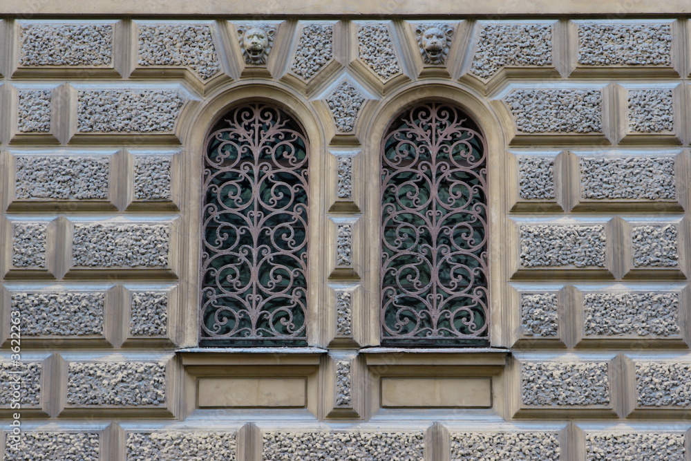 Vintage window with a lattice on old building