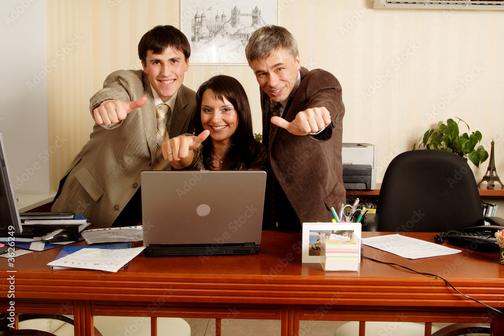 Group of business people working together in the office. Group of business people working together in the office.