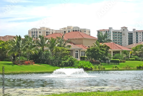 Spanish style tropical mansion on a canal.
