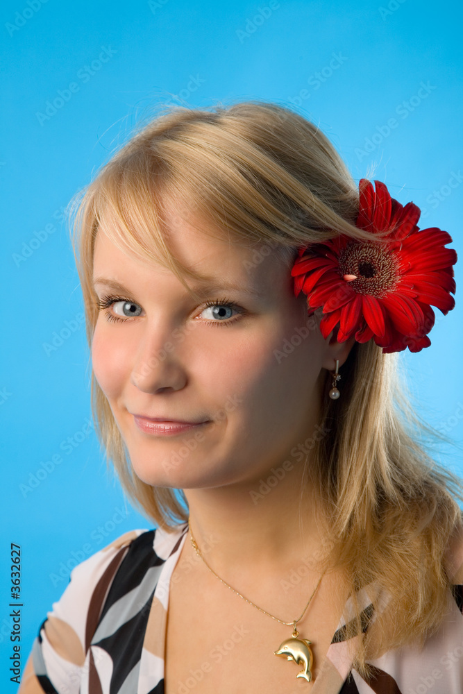 the pretty woman with flower on blue background the pretty woman with flower on blue background