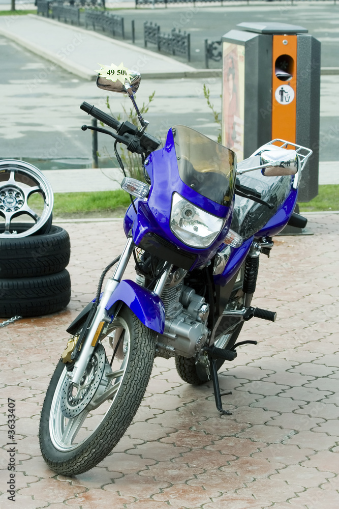 Fototapeta premium Motorcycle with the price list on exhibition.