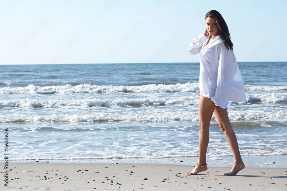 20-25 years old Beautiful Woman on the beach, wearing shirt