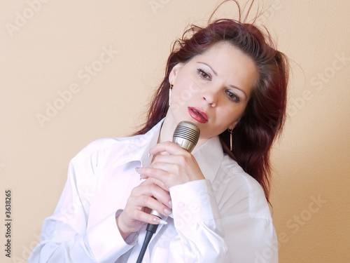 Girl singing in a microphone