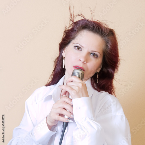 Girl singing in a microphone